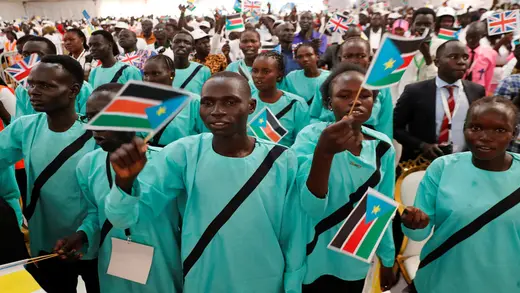 Internally displaced persons react as Pope Francis arrives to meet them at the Freedom Hall during his apostolic journey, in Juba, South Sudan, February 4, 2023.